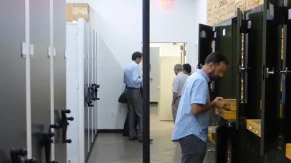 group of people in the ASUHIC collection room