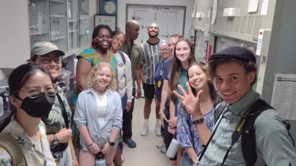 Group of smiling students in a lab